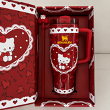 Stanley 40oz insulated tumbler with Hello Kitty heart design, pink background, matching gift box, pink handle