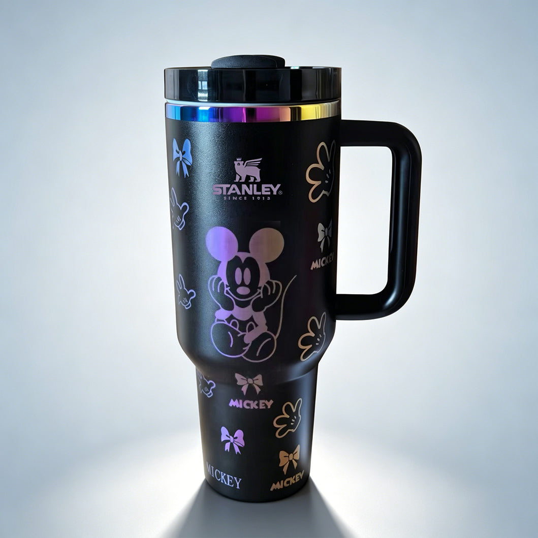 Stanley 40oz insulated tumbler featuring Mickey Mouse illustrations, bows and glove icons
