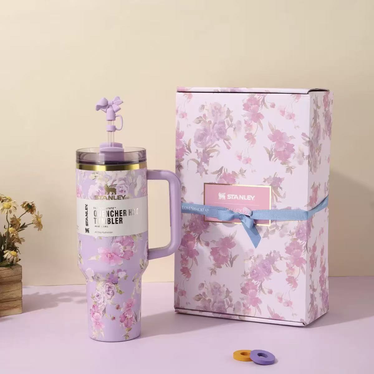 Purple and pink floral Stanley 40oz insulated tumbler with straw and matching gift box, elegant rose pattern design