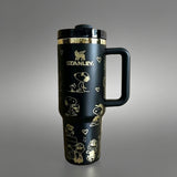 Stanley 40oz insulated tumbler with Snoopy and Woodstock illustrations, hearts and playful icons, white ergonomic handle
