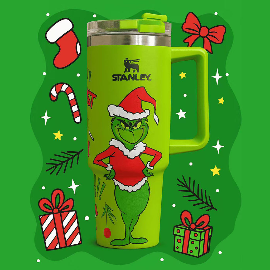 Stanley 40oz insulated tumbler featuring c background, holiday gift illustrations and green ergonomic handle
