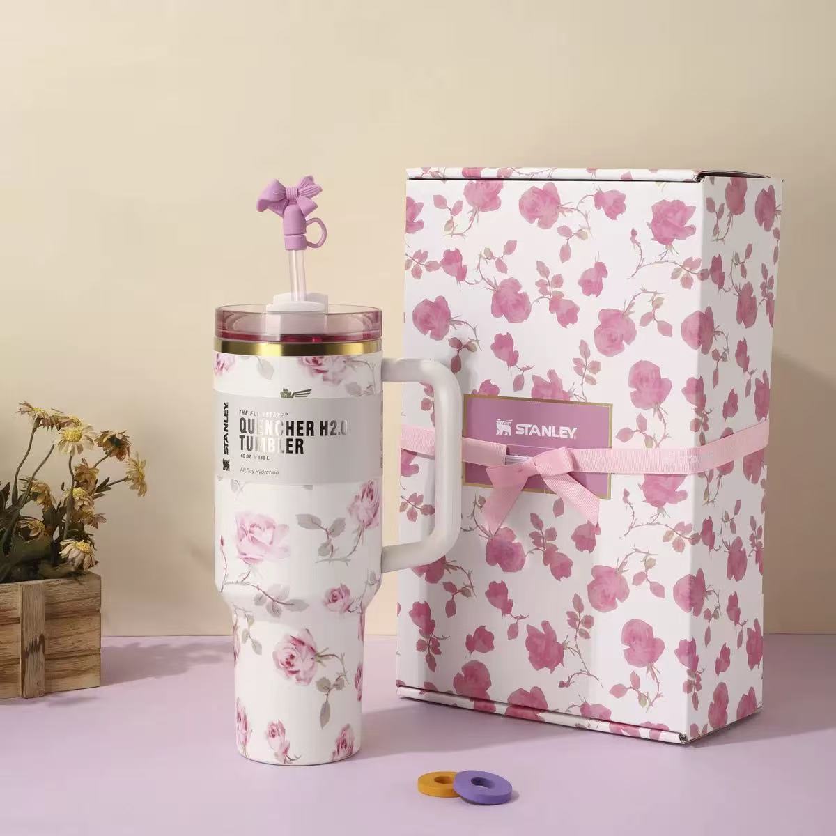 White and pink floral Stanley 40oz insulated tumbler with straw and matching gift box, pink ribbon design