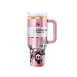 Stanley x Labubu Quencher H2.0 Tumbler with handle and straw, featuring a pink striped design with cartoon characters.